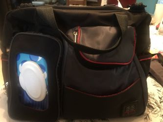 Black and red diaper bag and changing pad