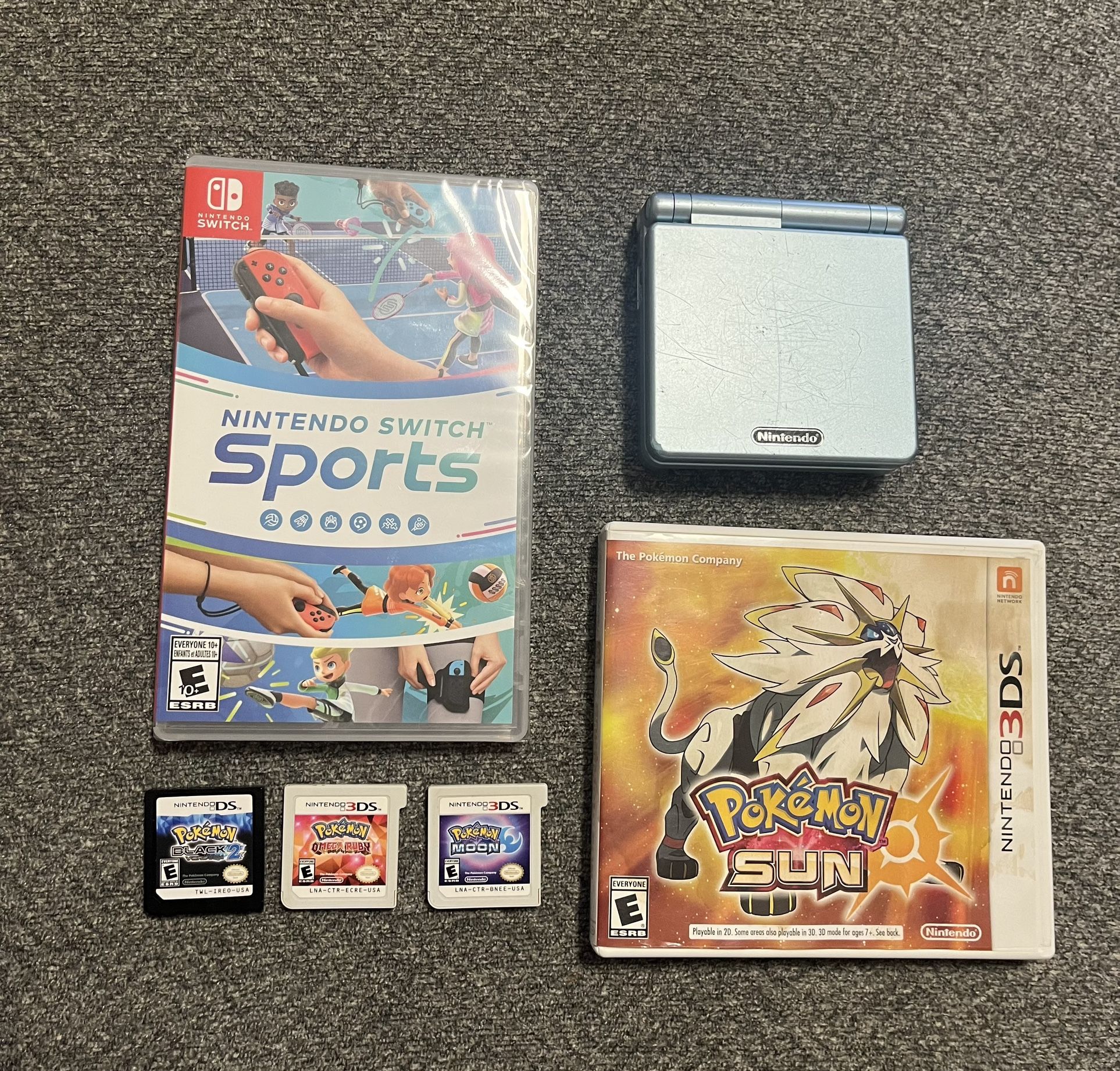 Nintendo Game Lot (Gameboy Advance SP, Pokemon Black Version 2, Pokemon Sun & Moon, Pokémon Omega Ruby, Nintendo Switch Sports)
