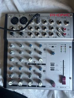 Phonic AM220 Compact Mixer featuring two microphone inputs and multiple stereo line inputs.