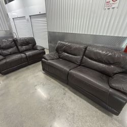 Set of dark brown leather manual recliner sofas