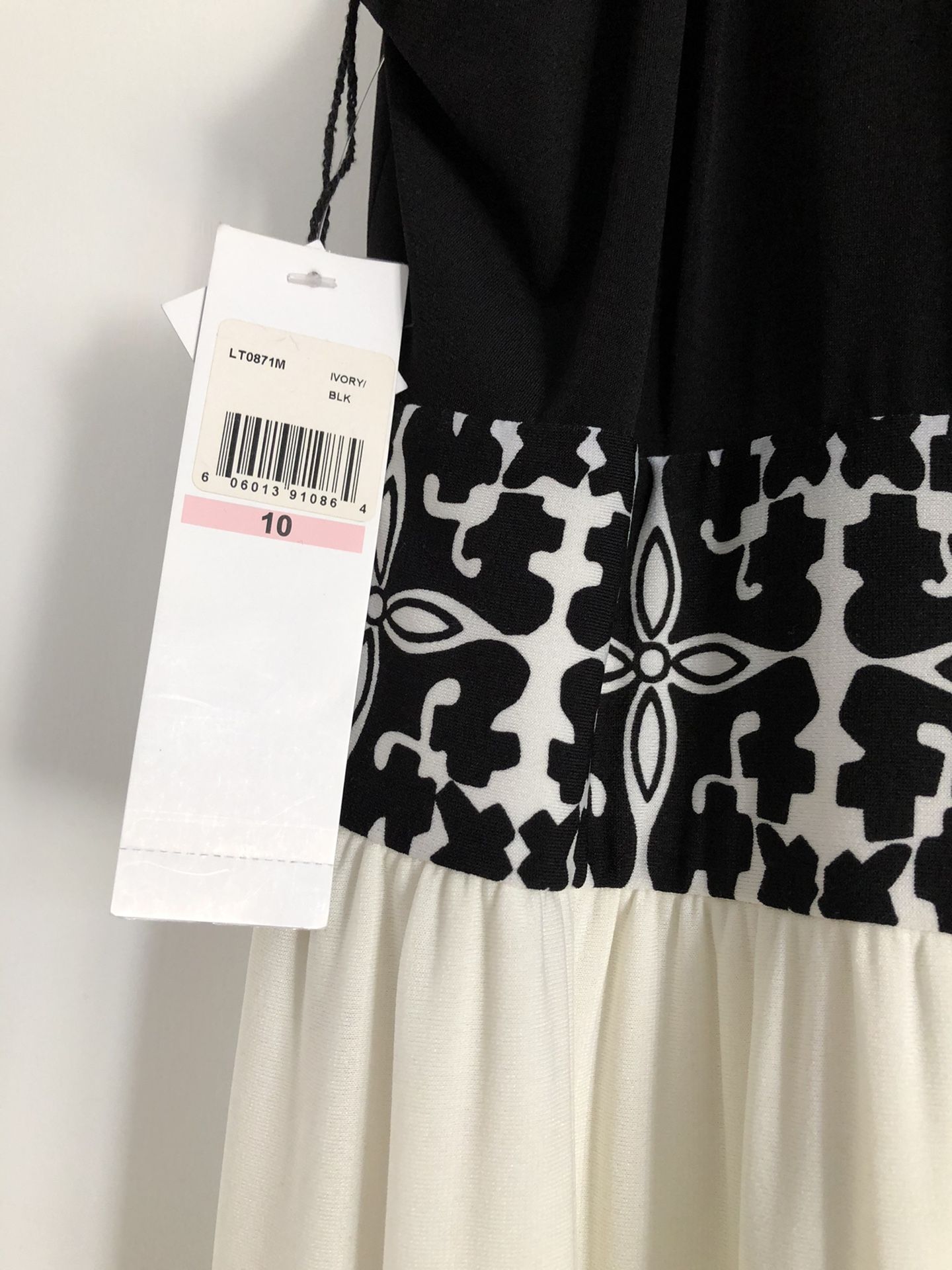 Beautiful black and white dress .