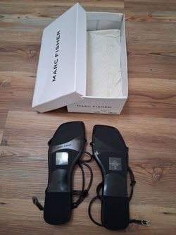 New, never worn Marc Fisher "Flueth" black flat ankle wrap sandals