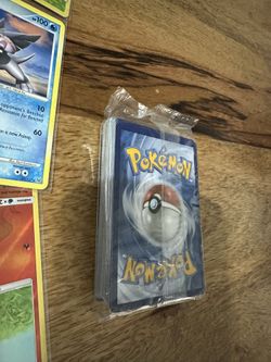 Pokemon Cards And One Unopened Pack 
