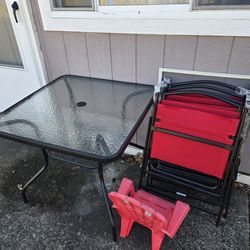 New Glass Patio Table & 4 Red Chairs