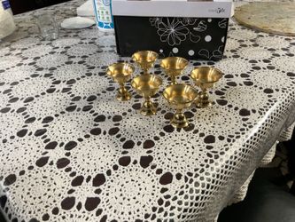 set of six small brass pedestal cups/candle holders (possibly tealight holders, oil-lamp cups, or decorative serving cups).