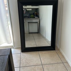 Dark brown wall mirror