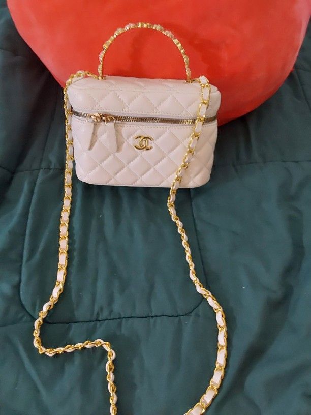 👜
