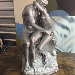 reproduction of Auguste Rodin's famous sculpture, The Kiss.