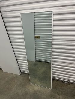 White frame border mirror hanging