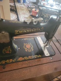 Antique minnisota ,parlor stand, sewing machine.