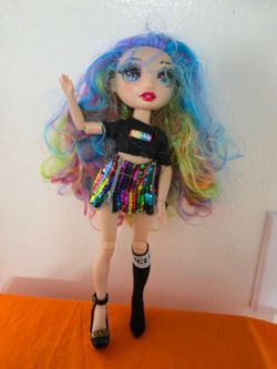 Rainbow High Amaya Raine Doll Colorful fashion doll has long rainbow hair and articulated limbs. Outfit includes black crop top with graphic and multi