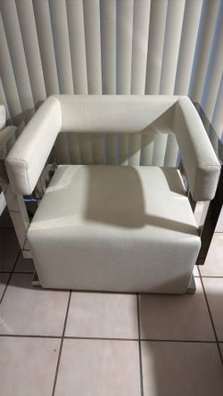 2 single white chairs