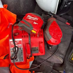 Miwaukee battery charger and tape measure and chalk line