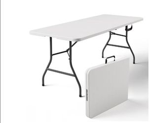 Folding plastic table