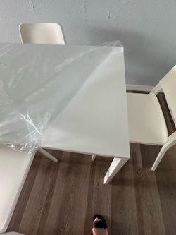 IKEA dining table with four chairs