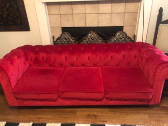 Red tufted sofa