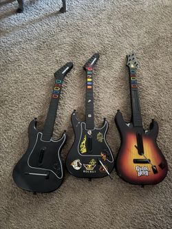 3 PlayStation 2 guitar hero controllers with connector plugs