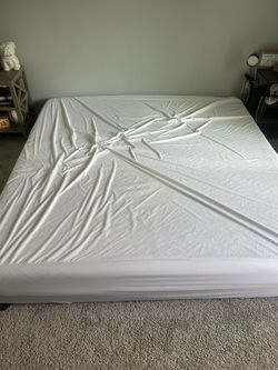BRAND NEW King Size mattress, With Pad And Cover.