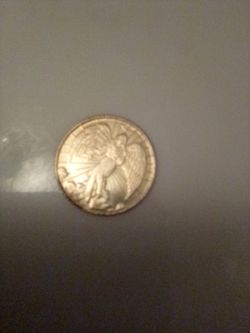 Silver-Tone Coin with Angel Figure Design