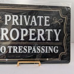 Black and gold metal 2  "Private Property No Trespassing" signs