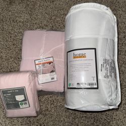 Twin comforter with light pink duvet cover and light pink bed skirt 