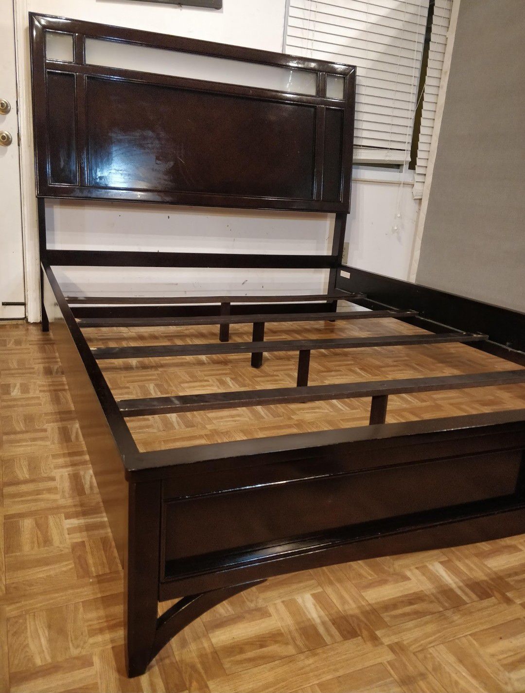 Nice modern wooden Queen bed frame in good condition.