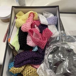 box of assorted baby headbands 