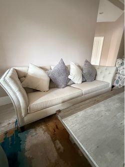 Three year-old Ethan Alan sofa
