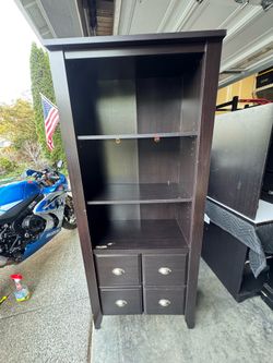 Tall bookshelf with storage
