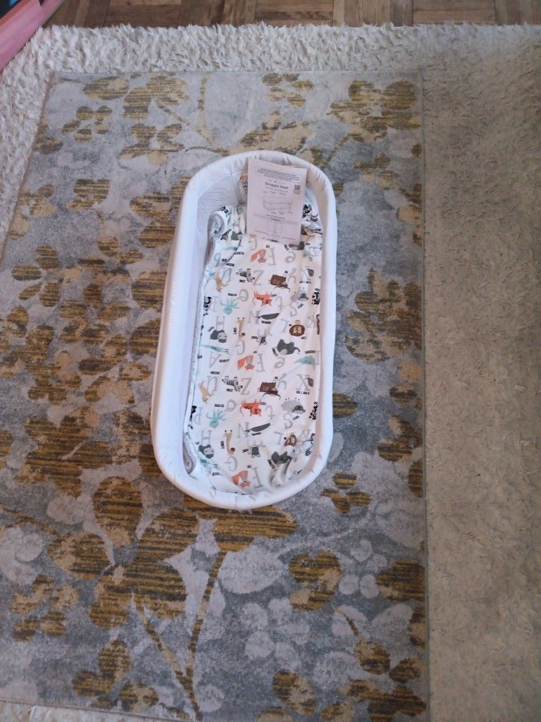 Snuggle Nest Portable Infant Bassinet And New Blanket