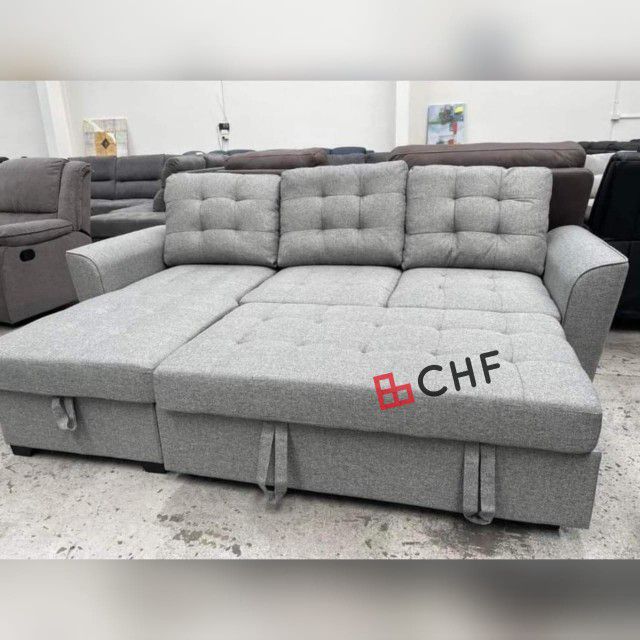 Living room sectional sofa with storage chaise and pull out bed 