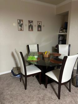 Glass Table with White Faux Leather Chairs