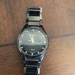 Seiko black solar power watch with date