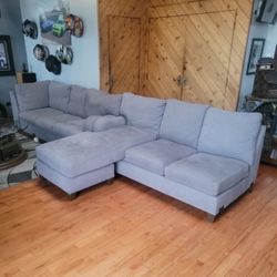 2 PC Sectional Grey In Color. Soft. No Damage Or Smoking