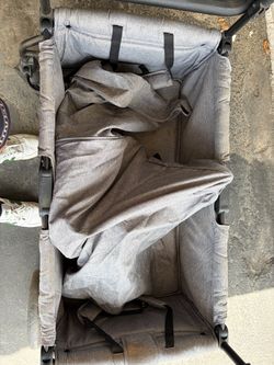 Baby/ kid folding wagon with shade cover on top.