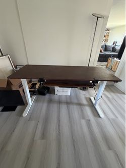 Standing desk with keypad drawer