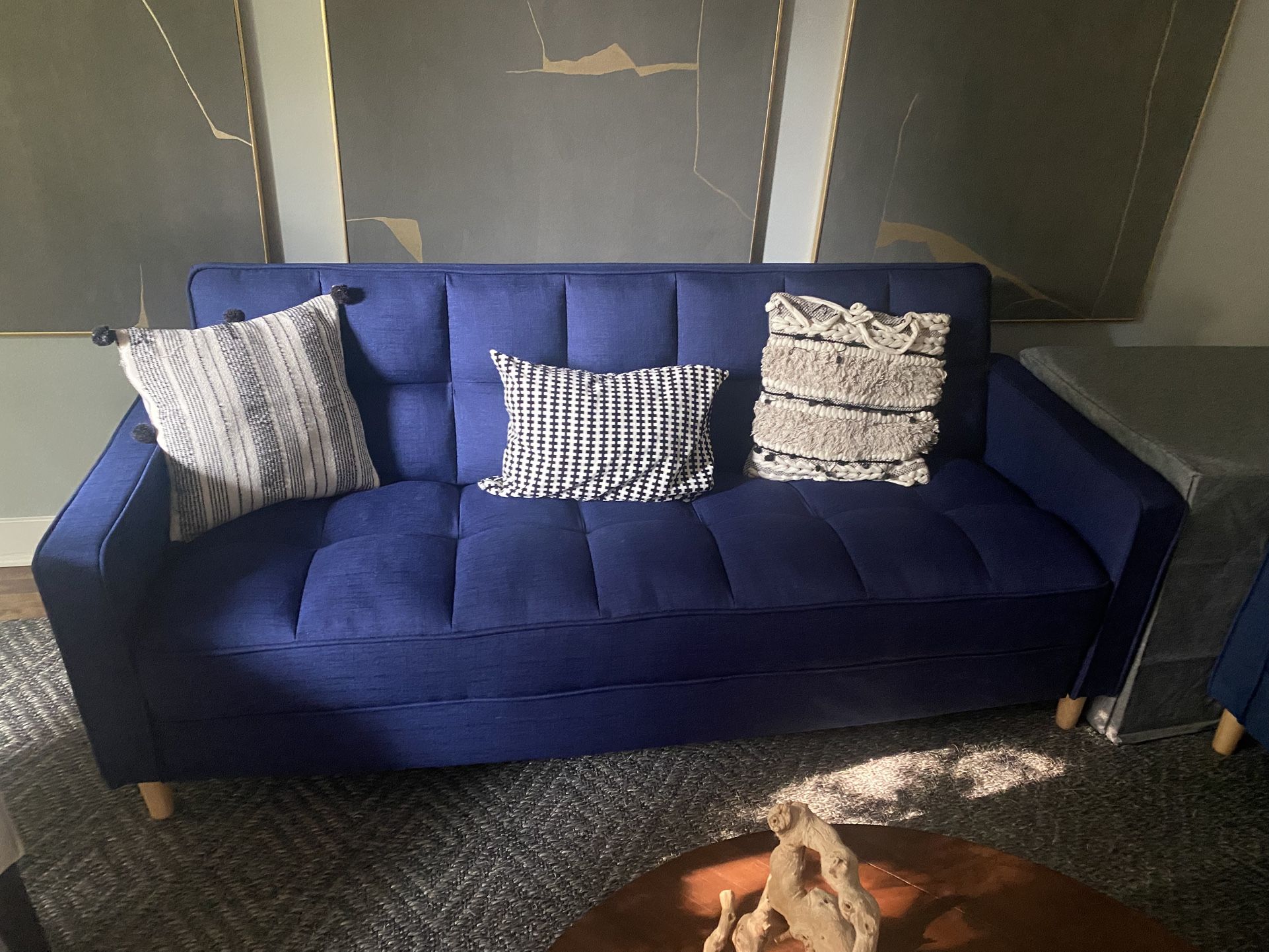 Two blue couches