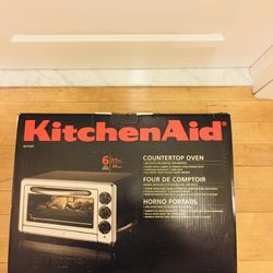 Famous Kitchen Aid countertop oven. Like new condition. Still in original box. 0.5 cu ft. 1400 watts. Bake, Broil, Toast, Warm. So powerful, so spacio