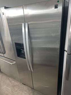 Kenmore stainless steel side by side refrigerator -free delivery