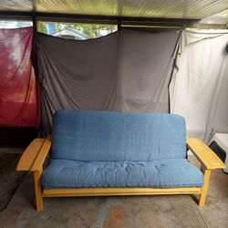 Wooden Framed Futon With Fold out side Tables