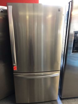 Kenmore stainless steel bottom freezer fridge. 1 year warranty