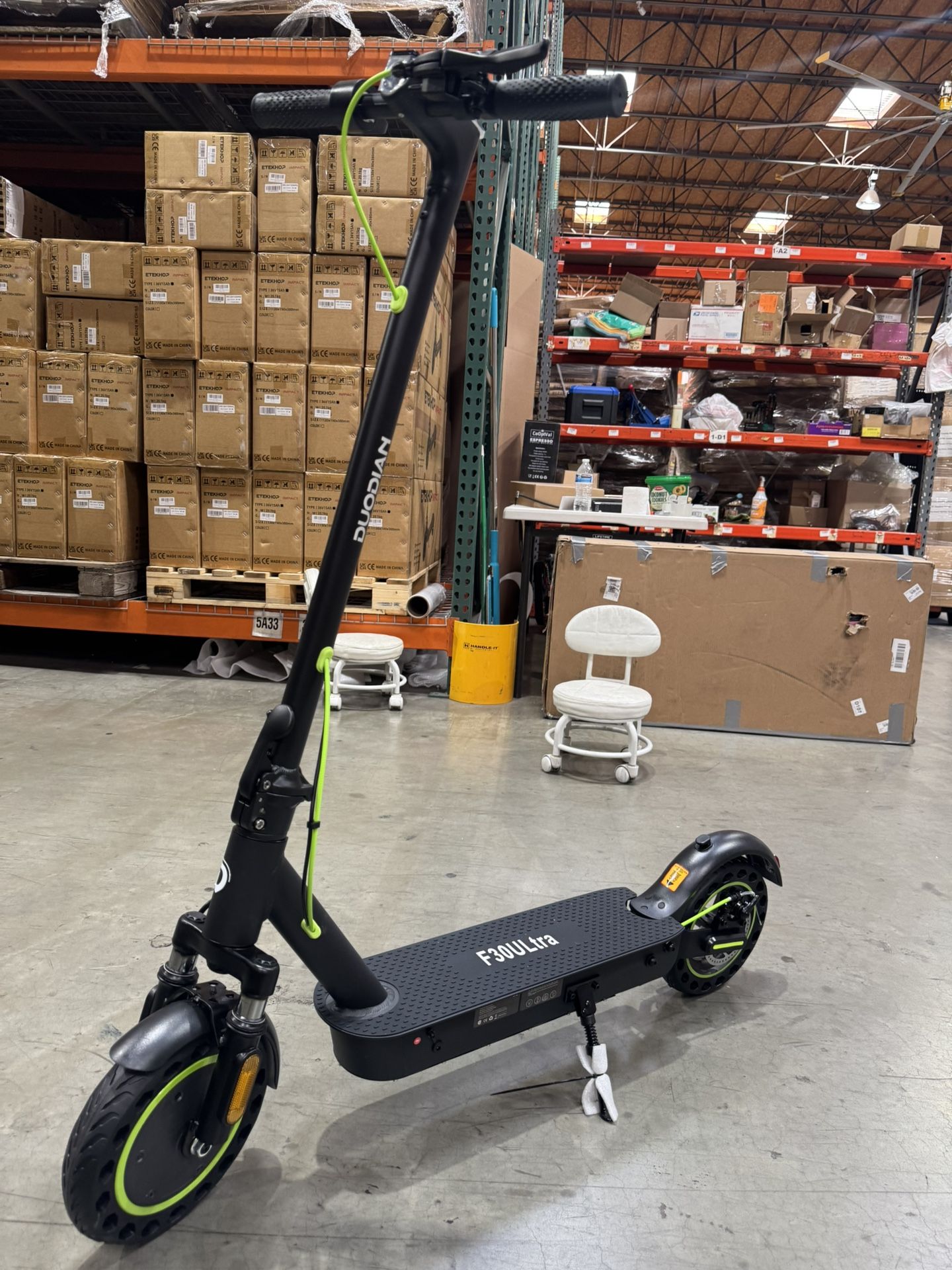 Electric scooters with front and rear shock absorbers