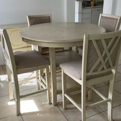 Table and chair set with small cabinet.