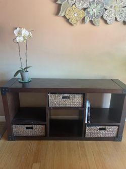 Wooden storage shelf with woven baskets