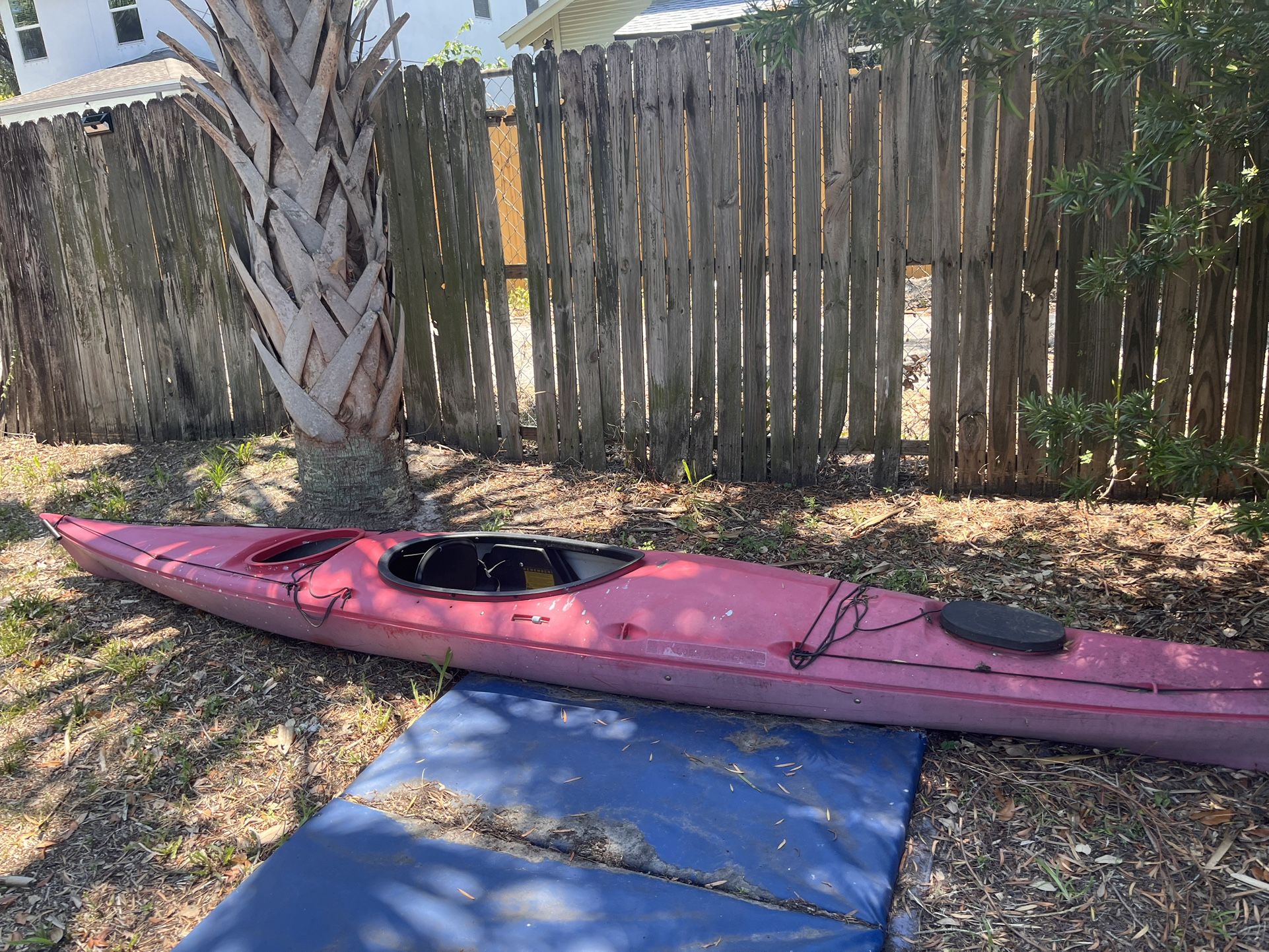 Sea Kayak With Oar And Two Life Vests