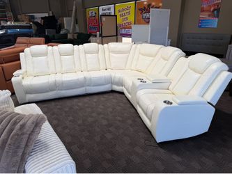 White leather reclining power sectional