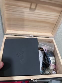 Wooden box filled with mixed costume jewelry