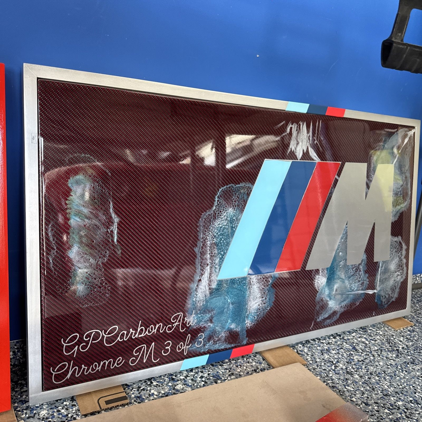 CHROME BMW M LOGO ON REAL RED CARBON FIBER CUSTOM ART WORK