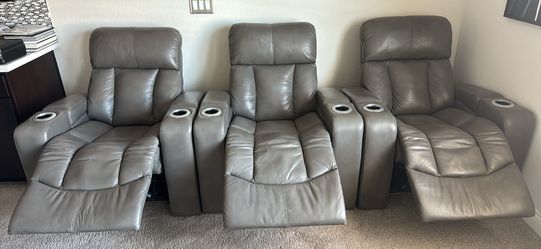 3 theater style powered recliners with power head rest and lighted cup holders
