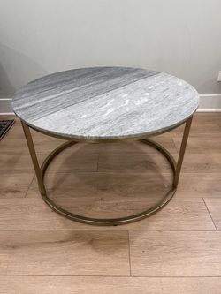 Solid granite round coffee table on gold accents